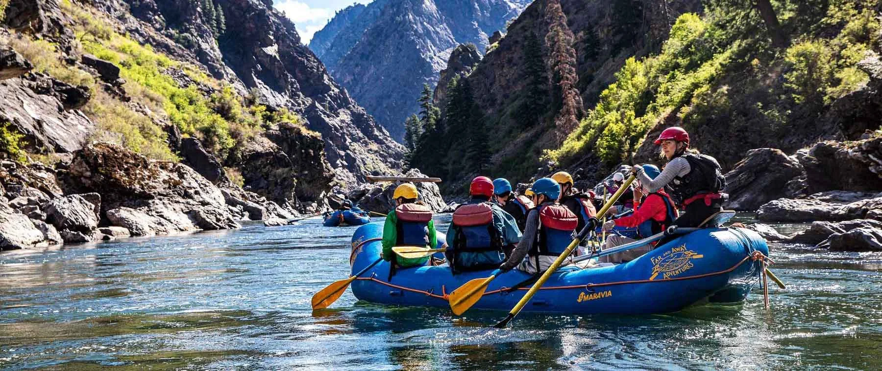 an adventure therapist leads a team through on a whitewater rafting activity