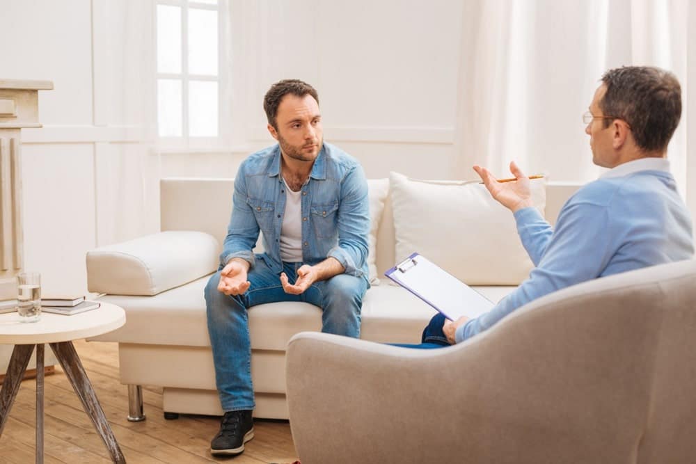 Man in Canadian tuxedo asking therapist about pink cocaine
