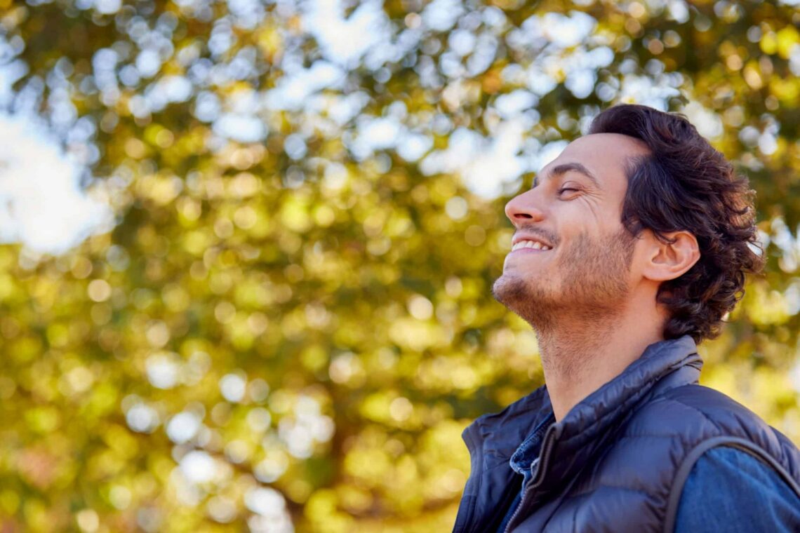 Man happily looking up during treatment for anorexia.
